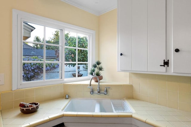 4920 Elsa Rd, San Diego, CA 92120 - kitchen with white cabinetry, decorative backsplash, ornamental molding, and tile counters
