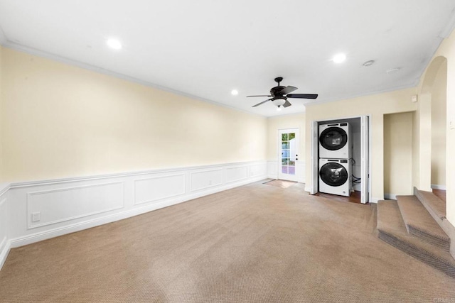4920 Elsa Rd, San Diego, CA 92120 - laundry area featuring stacked washer / dryer, carpet flooring, ceiling fan, wainscoting, and crown molding