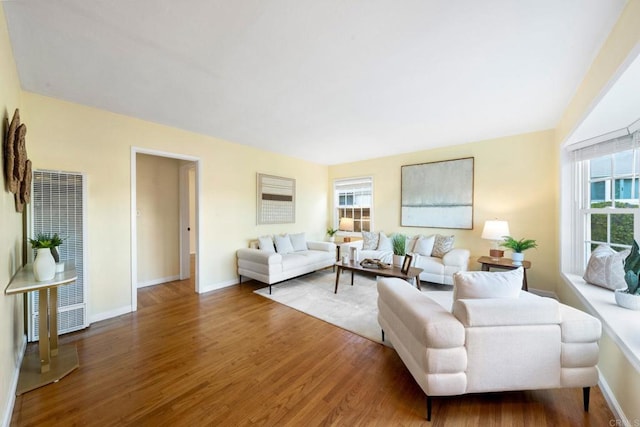 4920 Elsa Rd, San Diego, CA 92120 - living area with a heating unit, wood finished floors, and plenty of natural light