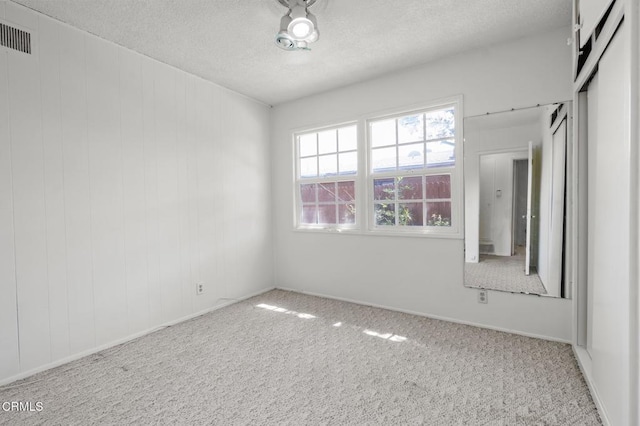929 Diamond St, Monrovia, CA 91016 - carpeted empty room featuring a textured ceiling and baseboards