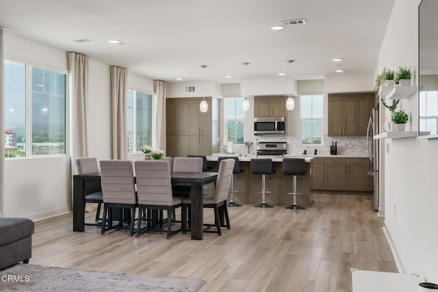 2850 Wagon Wheel Rd Unit 402, Oxnard, CA 93036 - dining space featuring light wood-type flooring and recessed lighting