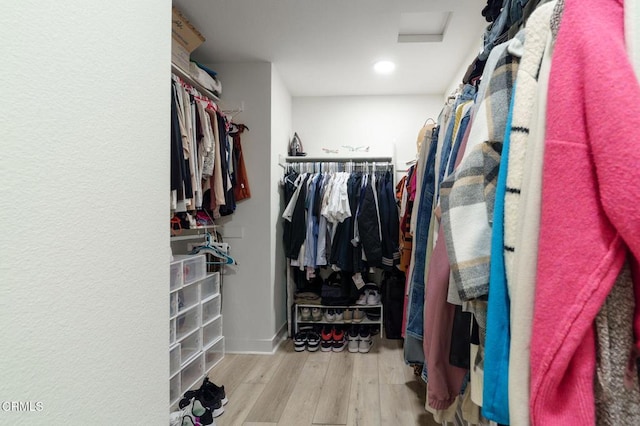 2850 Wagon Wheel Rd Unit 402, Oxnard, CA 93036 - walk in closet with wood finished floors and attic access