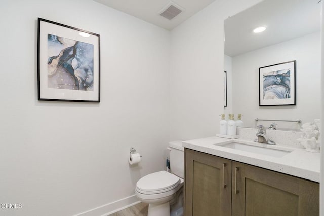 2850 Wagon Wheel Rd Unit 402, Oxnard, CA 93036 - half bath featuring vanity, wood finished floors, and recessed lighting