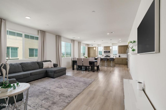 2850 Wagon Wheel Rd Unit 402, Oxnard, CA 93036 - living area featuring healthy amount of natural light, recessed lighting, and light wood finished floors