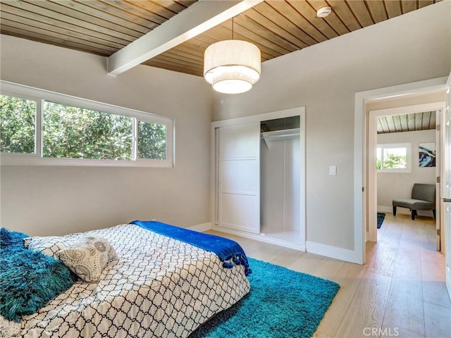 2310 W 169th Pl, Torrance, CA 90504 - bedroom featuring a wooden ceiling with exposed beams, light wood finished floors, and a closet