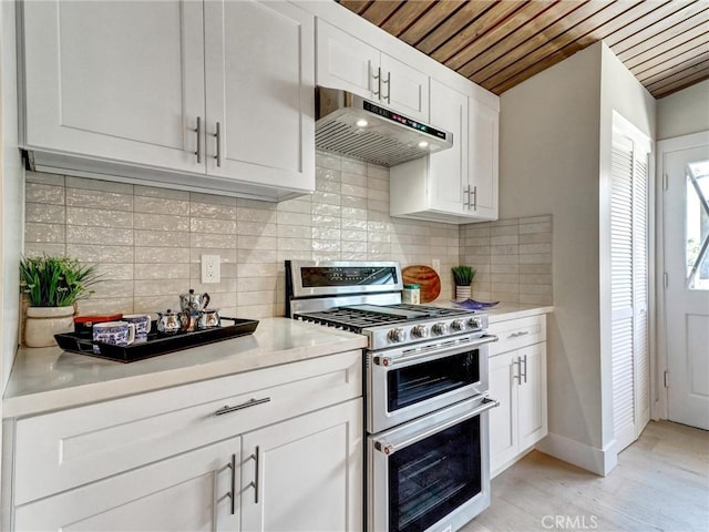2310 W 169th Pl, Torrance, CA 90504 - kitchen featuring double oven range, extractor fan, white cabinets, light countertops, and wooden ceiling