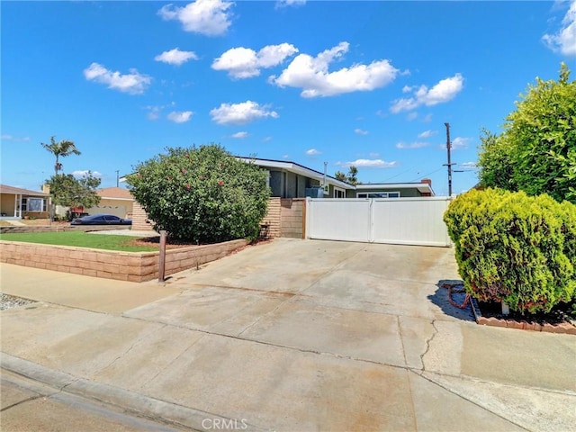 2310 W 169th Pl, Torrance, CA 90504 - mid-century inspired home with concrete driveway and a gate