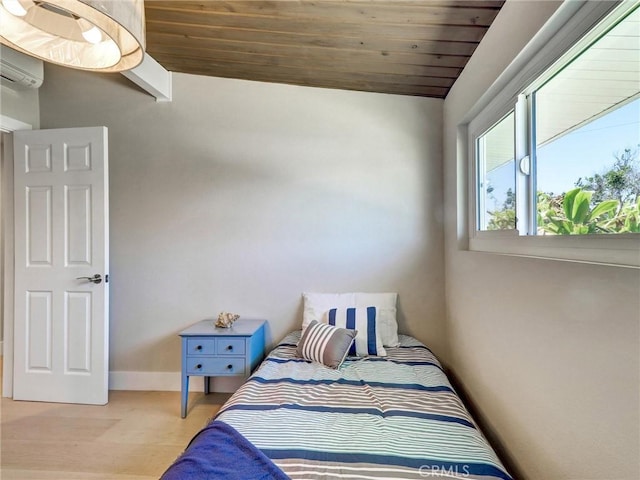 2310 W 169th Pl, Torrance, CA 90504 - bedroom with wood ceiling, wood finished floors, vaulted ceiling, and an AC wall unit