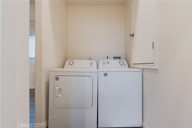 2461 Santa Ana N, Los Angeles, CA 90059 - washroom with washing machine and clothes dryer and baseboards