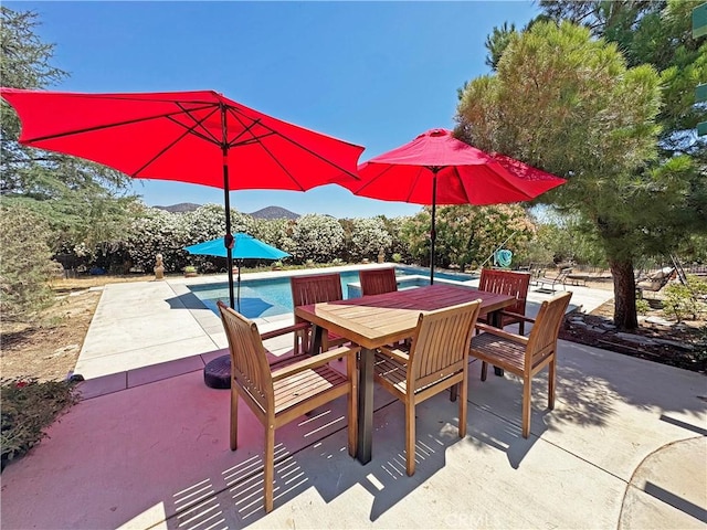 35728 Beauty Vista Ln, Agua Dulce, CA 91390 - view of patio with outdoor dining space, a mountain view, and an outdoor pool