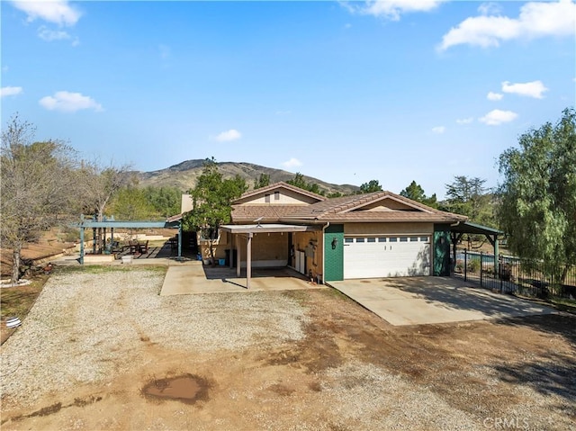 35728 Beauty Vista Ln, Agua Dulce, CA 91390 - view of front of house with a mountain view, a garage, and dirt driveway