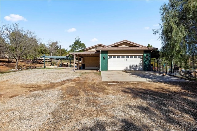 35728 Beauty Vista Ln, Agua Dulce, CA 91390 - view of front of home with a garage, dirt driveway, and a carport