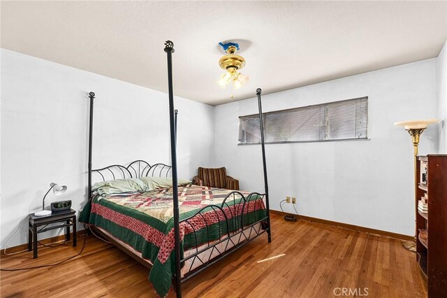 603 Reed Park Dr, Chico, CA 95926 - bedroom with wood finished floors and baseboards