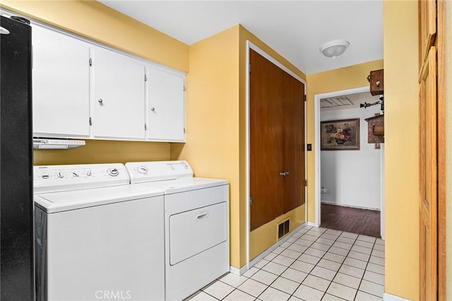 603 Reed Park Dr, Chico, CA 95926 - laundry area with cabinet space, washer and dryer, and light tile patterned flooring
