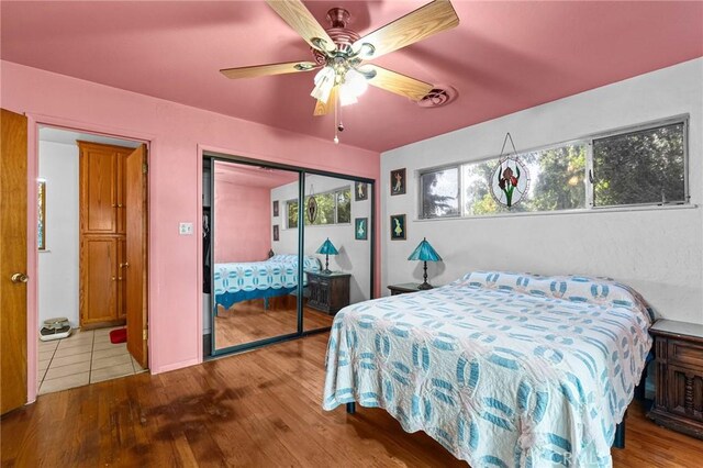 603 Reed Park Dr, Chico, CA 95926 - bedroom with wood finished floors, multiple windows, and a closet