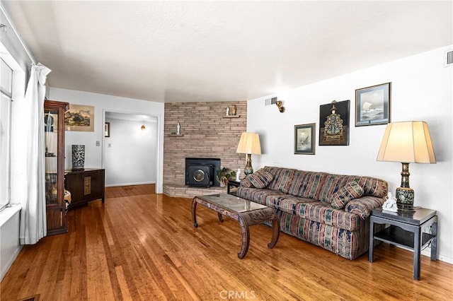 603 Reed Park Dr, Chico, CA 95926 - living room with wood finished floors and a wood stove
