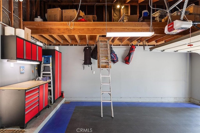 270 N Orange Grove Blvd, Pasadena, CA 91103 - garage with a garage door opener and baseboards