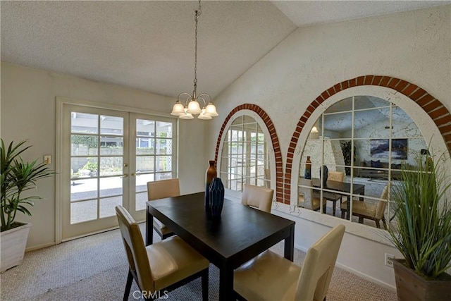 18342 Piper Pl, Yorba Linda, CA 92886 - carpeted dining area featuring lofted ceiling, a chandelier, a textured ceiling, and french doors