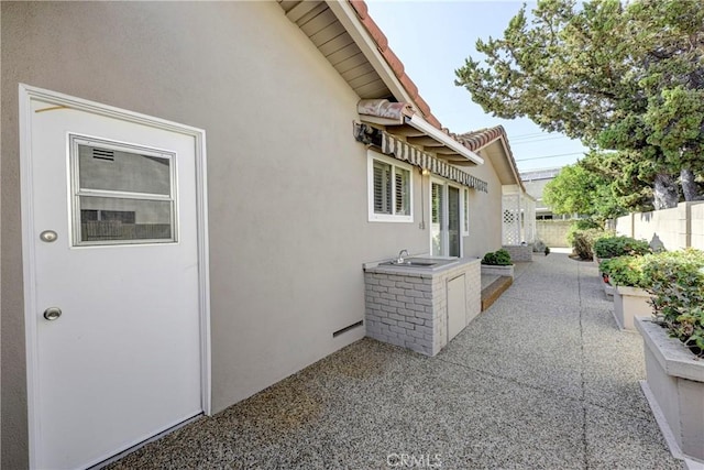 18342 Piper Pl, Yorba Linda, CA 92886 - view of property exterior with stucco siding and a patio