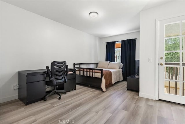 12411 Osborne St Unit 17, Pacoima, CA 91331 - bedroom featuring wood finished floors and an office area