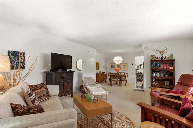 922 Avenida Majorca Unit O, Laguna Woods, CA 92637 - living room featuring a chandelier, light colored carpet, and a textured ceiling