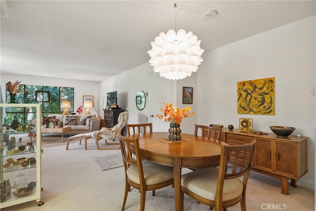922 Avenida Majorca Unit O, Laguna Woods, CA 92637 - dining space featuring light colored carpet, a chandelier, and a textured ceiling