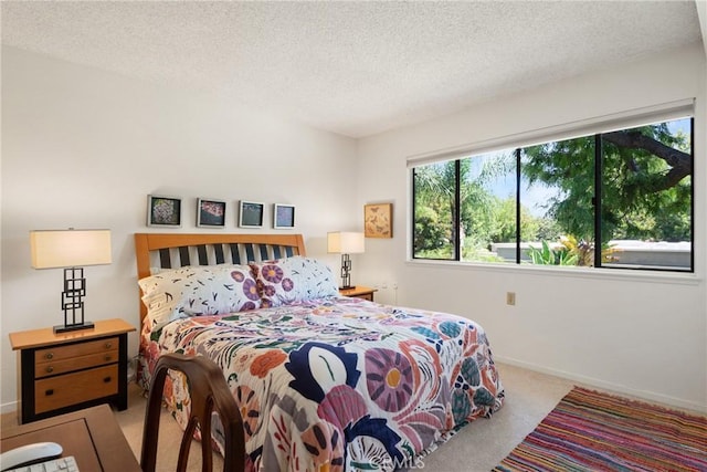 922 Avenida Majorca Unit O, Laguna Woods, CA 92637 - carpeted bedroom featuring a textured ceiling and baseboards