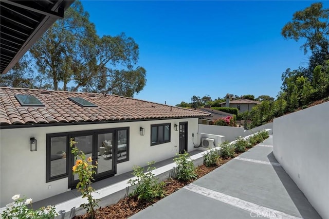 2708 Via Elevado, Palos Verdes Estates, CA 90274 - view of side of home with stucco siding, a tile roof, and a porch