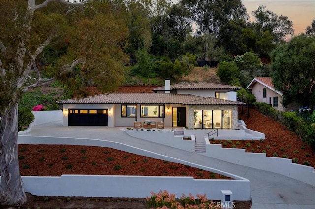 2708 Via Elevado, Palos Verdes Estates, CA 90274 - mediterranean / spanish house with a tile roof, a garage, a chimney, and stucco siding
