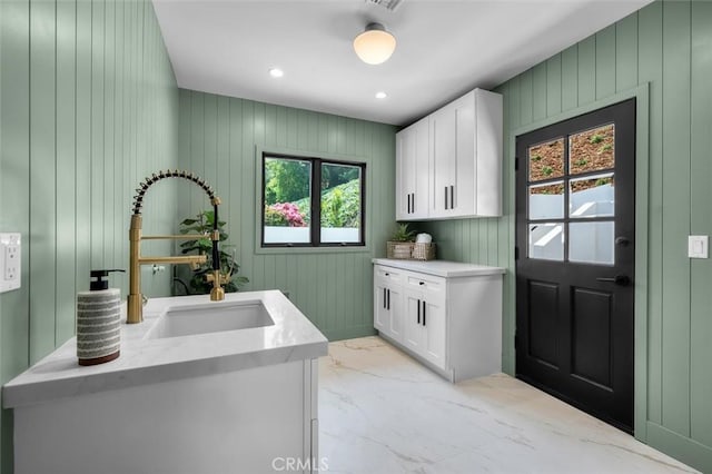 2708 Via Elevado, Palos Verdes Estates, CA 90274 - washroom featuring light marble finish flooring, cabinet space, wood walls, and recessed lighting