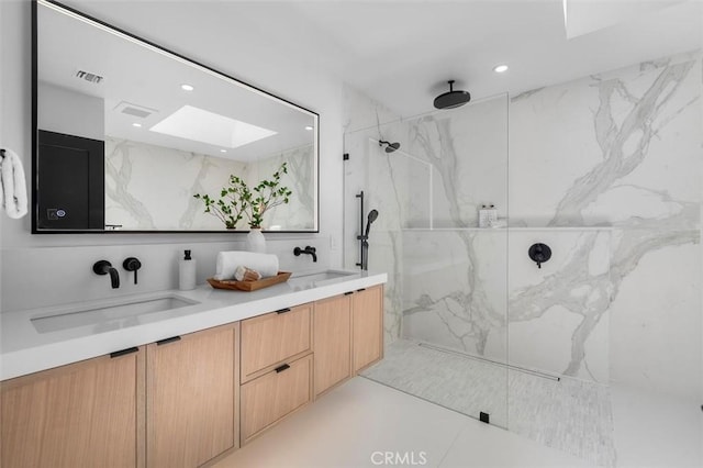 2708 Via Elevado, Palos Verdes Estates, CA 90274 - full bathroom featuring a skylight, a marble finish shower, double vanity, and recessed lighting