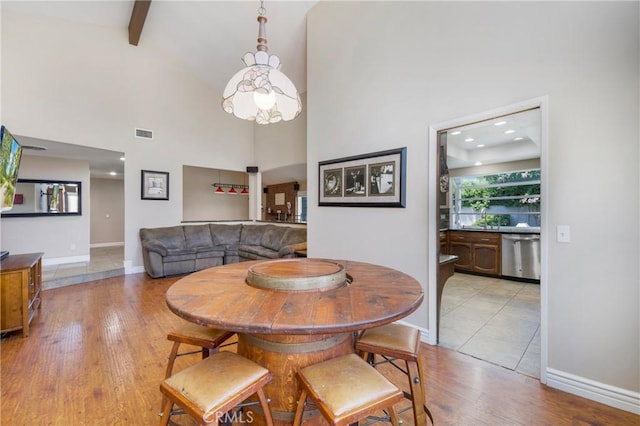 4441 Rustic Rd, Yorba Linda, CA 92886 - dining area featuring light wood-style floors, high vaulted ceiling, and beam ceiling