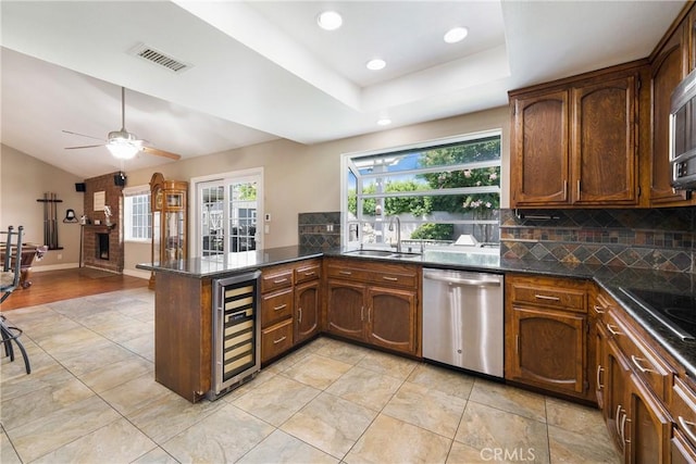 4441 Rustic Rd, Yorba Linda, CA 92886 - kitchen featuring stainless steel dishwasher, wine cooler, plenty of natural light, a peninsula, and recessed lighting
