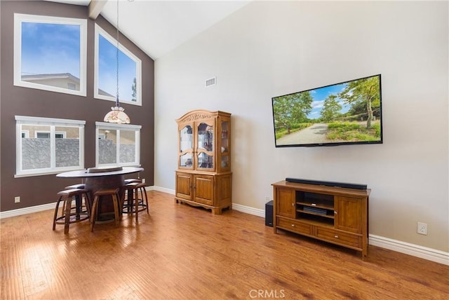 4441 Rustic Rd, Yorba Linda, CA 92886 - dining area with high vaulted ceiling, wood finished floors, and beamed ceiling