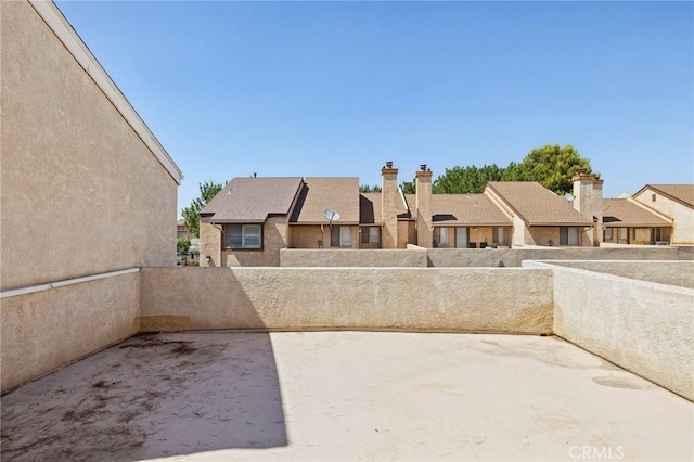 1832 E E Ave J2, Unit 2, Lancaster, CA 93535 - view of patio featuring a residential view