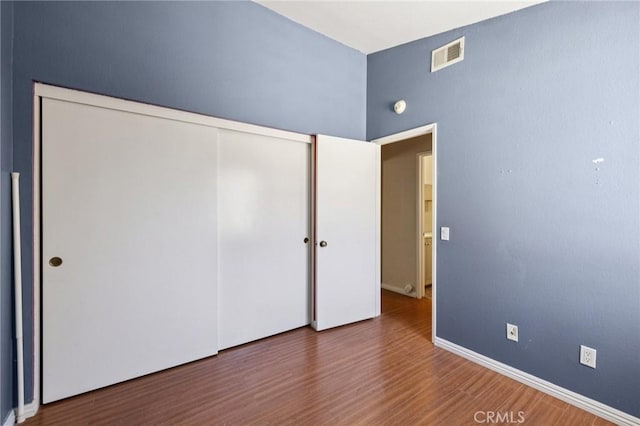 1832 E E Ave J2, Unit 2, Lancaster, CA 93535 - unfurnished bedroom with a closet and wood finished floors