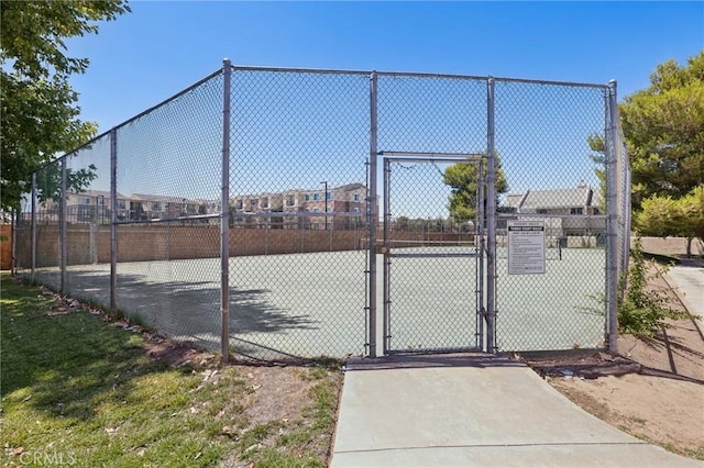 1832 E E Ave J2, Unit 2, Lancaster, CA 93535 - view of tennis court with a gate