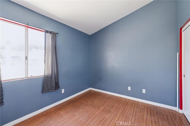 1832 E E Ave J2, Unit 2, Lancaster, CA 93535 - unfurnished room with wood finished floors and baseboards