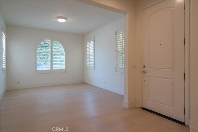8656 Harvest Pl, Rancho Cucamonga, CA 91730 - foyer featuring light wood-type flooring and baseboards