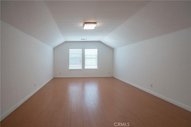 8656 Harvest Pl, Rancho Cucamonga, CA 91730 - additional living space featuring lofted ceiling and light wood-style flooring