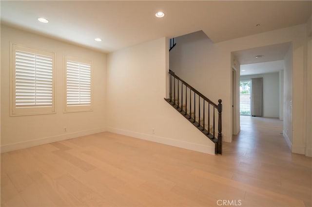 8656 Harvest Pl, Rancho Cucamonga, CA 91730 - spare room with light wood-type flooring, stairs, and recessed lighting