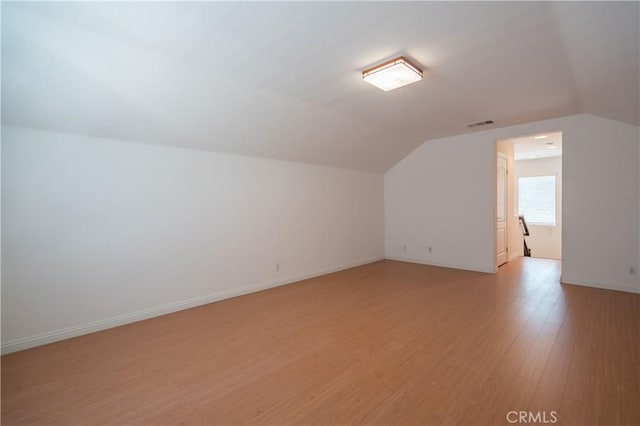 8656 Harvest Pl, Rancho Cucamonga, CA 91730 - additional living space with vaulted ceiling and light wood-style flooring
