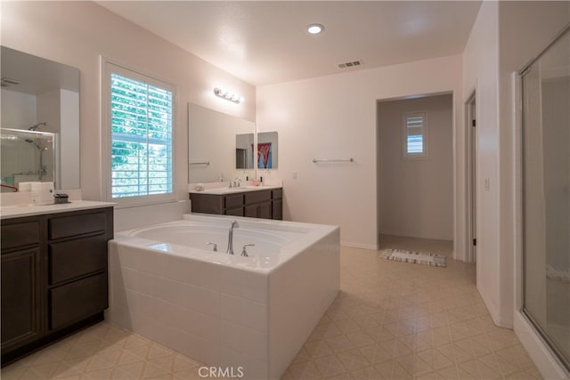 8656 Harvest Pl, Rancho Cucamonga, CA 91730 - full bathroom with plenty of natural light, a stall shower, vanity, and a garden tub