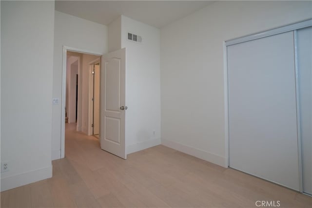 8656 Harvest Pl, Rancho Cucamonga, CA 91730 - unfurnished bedroom featuring light wood finished floors and a closet