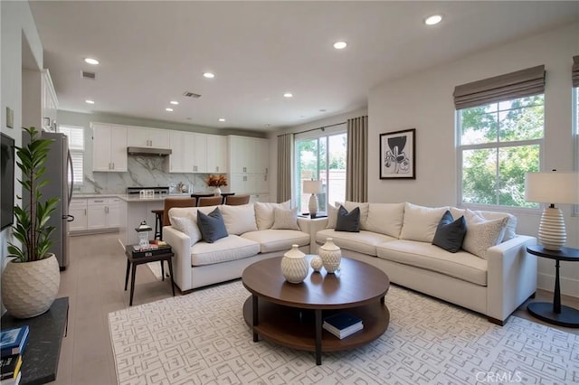8656 Harvest Pl, Rancho Cucamonga, CA 91730 - living area featuring recessed lighting and light wood-style flooring