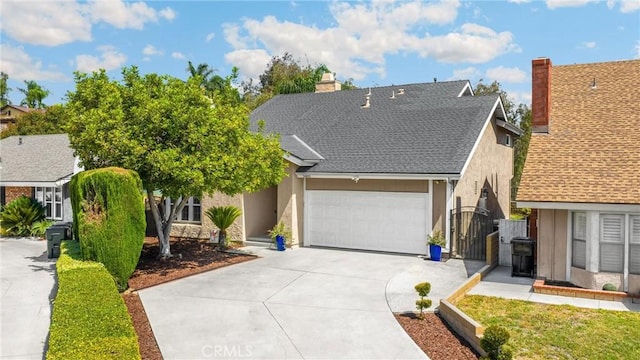 2405 E Alicia St, West Covina, CA 91792 - view of front facade with concrete driveway, stucco siding, a garage, a gate, and a shingled roof