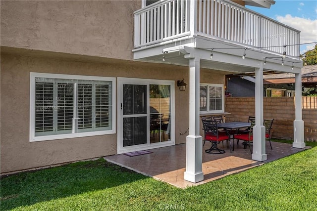 2405 E Alicia St, West Covina, CA 91792 - rear view of property featuring a balcony, stucco siding, and a patio area