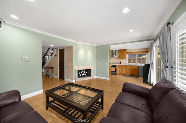 2405 E Alicia St, West Covina, CA 91792 - living area with stairway, light wood-type flooring, recessed lighting, and crown molding