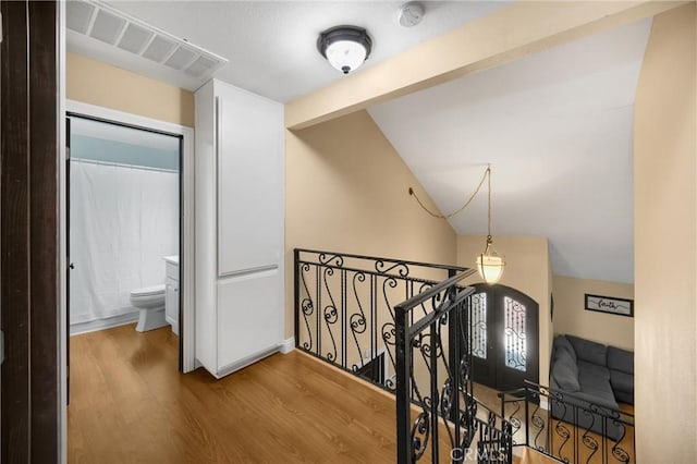 2405 E Alicia St, West Covina, CA 91792 - hallway with an upstairs landing, wood finished floors, and lofted ceiling