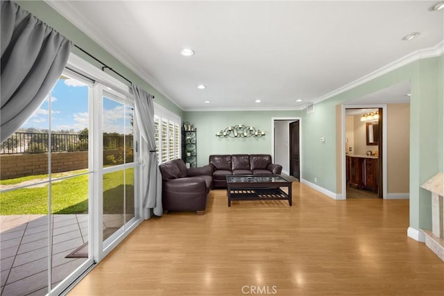 2405 E Alicia St, West Covina, CA 91792 - living room with light wood-style flooring, ornamental molding, and recessed lighting